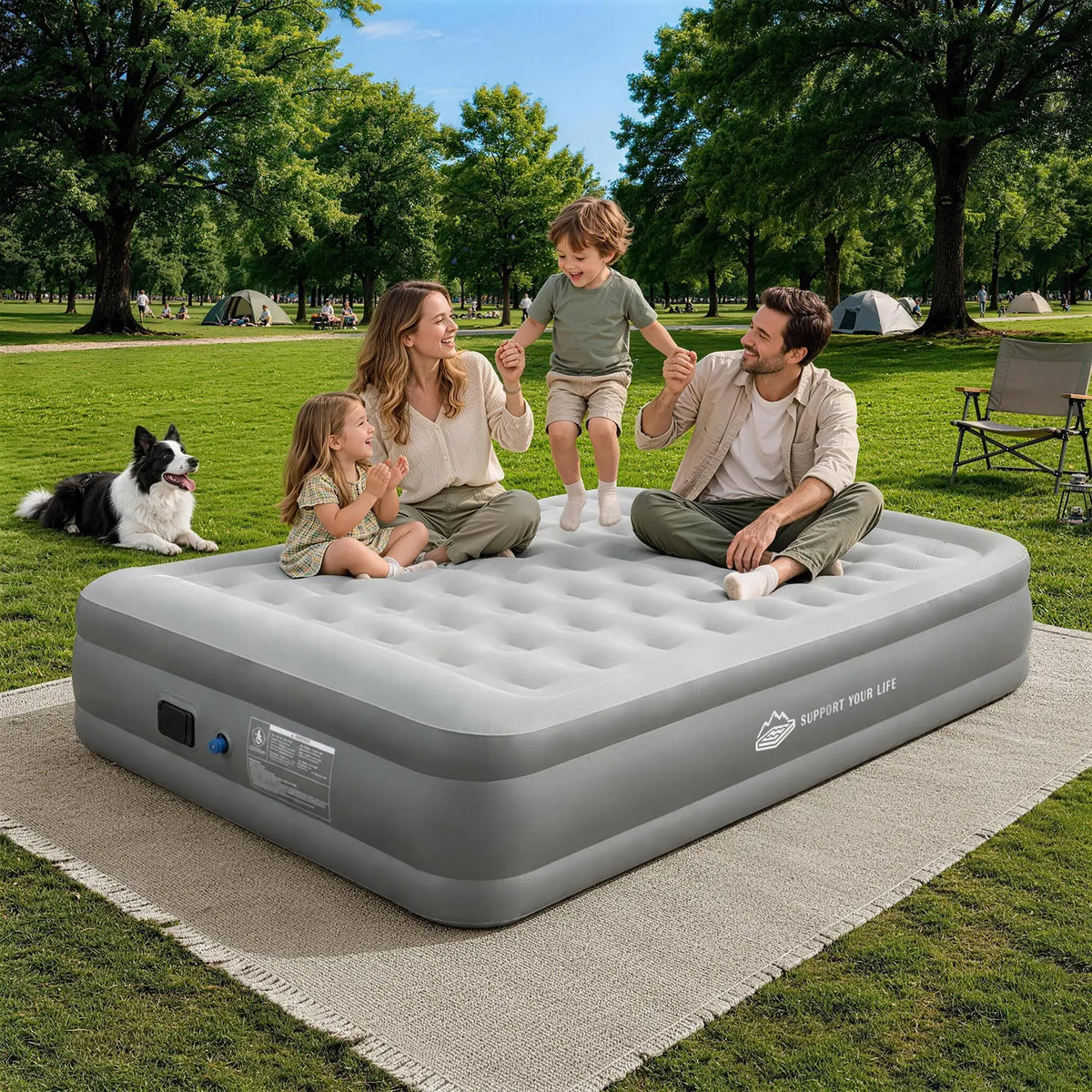 Family relaxing together on a JUITOY air mattress in a sunny park setting