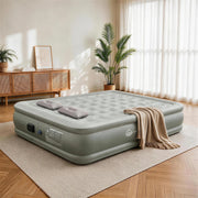 JUITOY Queen air mattress set up in a warm guest room